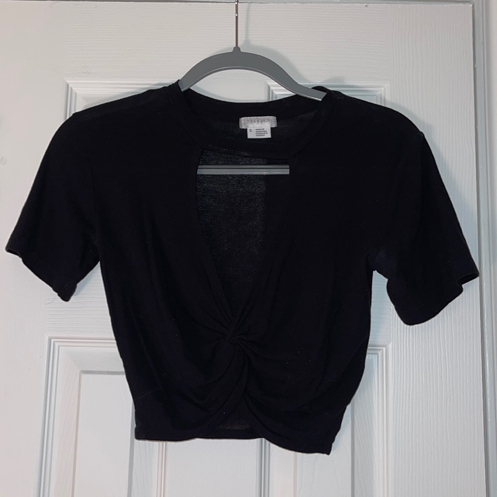 Black crop top that opens in front from Urban Outfitters. Size Small